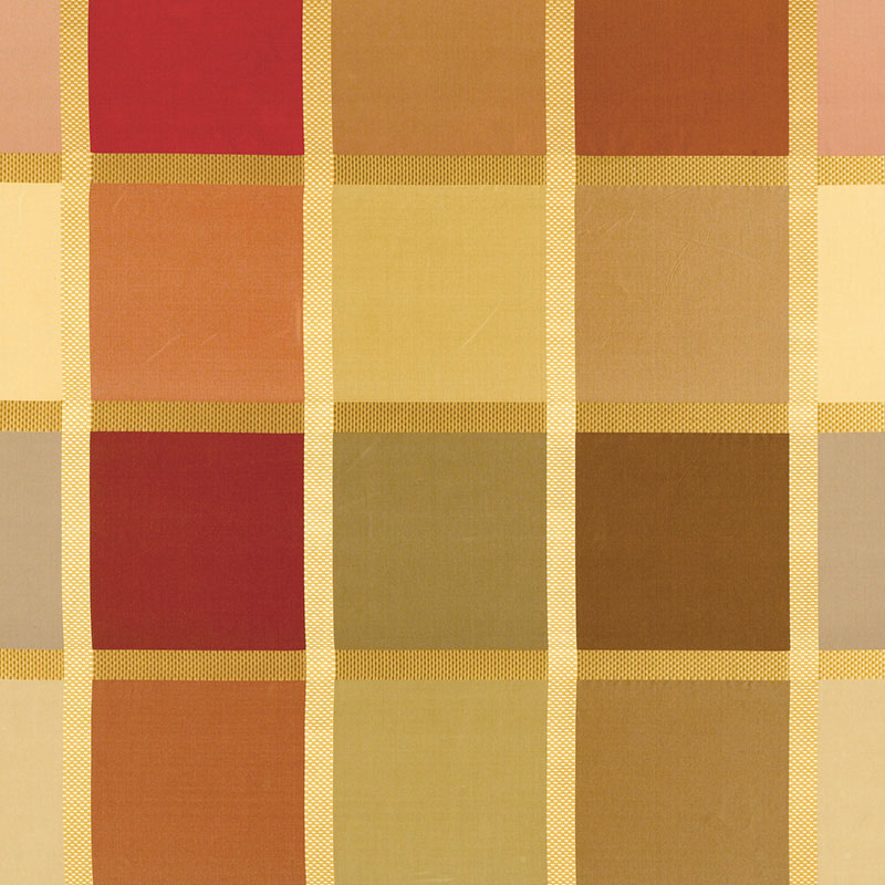 Warm plaid fabric in orange, mustard, and tan squares with gold grid lines; cozy upholstery or apparel textile.