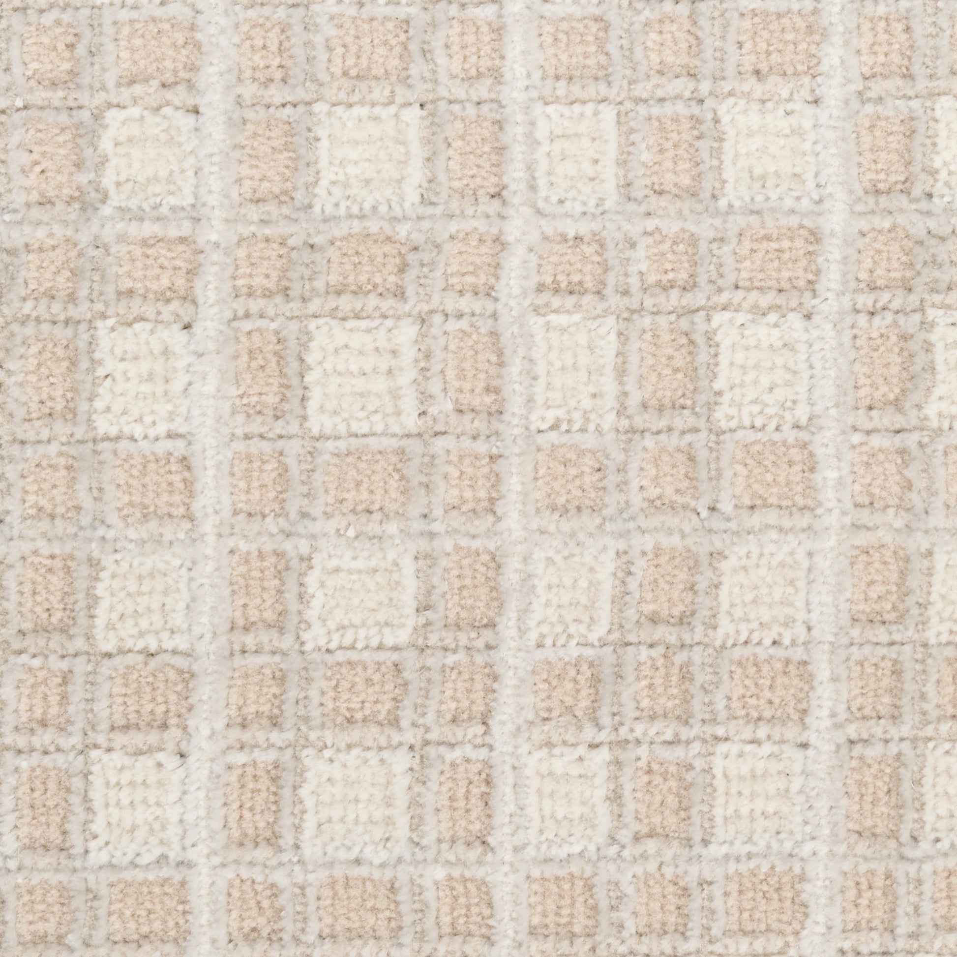 Beige and cream tufted rug with a square grid pattern; plush texture, ideal as a bath mat or small area rug.