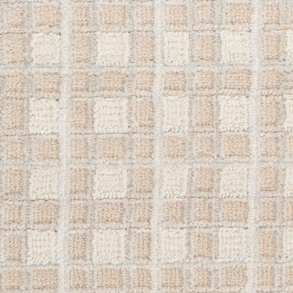 Beige and cream tufted rug with a square grid pattern; plush texture, ideal as a bath mat or small area rug.