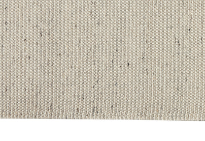 Beige textured woven rug close-up with looped yarn and subtle gray flecks for a casual modern look
