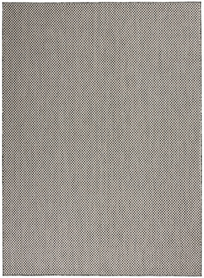 Beige flat-weave rug with a tiny black diamond lattice pattern.