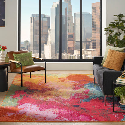 Bright urban living room with vibrant abstract rug, leather lounge chair, dark sofa, colorful pillows, and city skyline view.