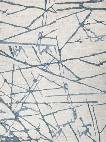 Ivory rug with abstract blue-gray branch-like lines forming intersecting geometric pattern; modern decor.