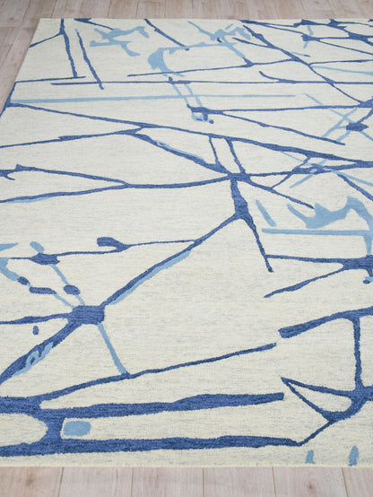 Abstract blue line pattern rug on cream background; indoor hand-tufted rectangular area rug, 6' x 9', for the living room.