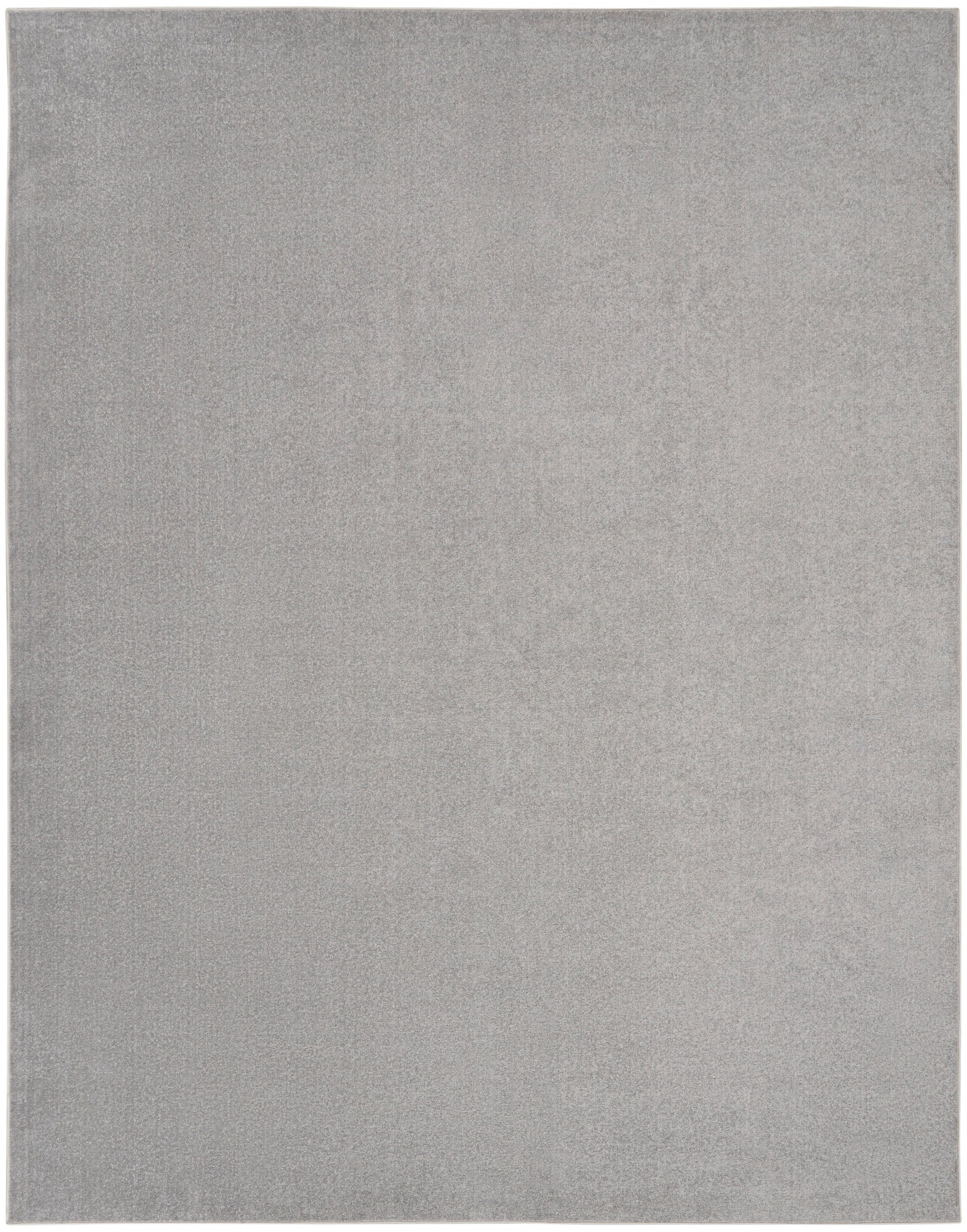 Light gray rectangular rug with soft plush texture and subtle tonal variation.