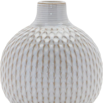 Set of four natural and off-white ceramic bud vases with sculptural details.