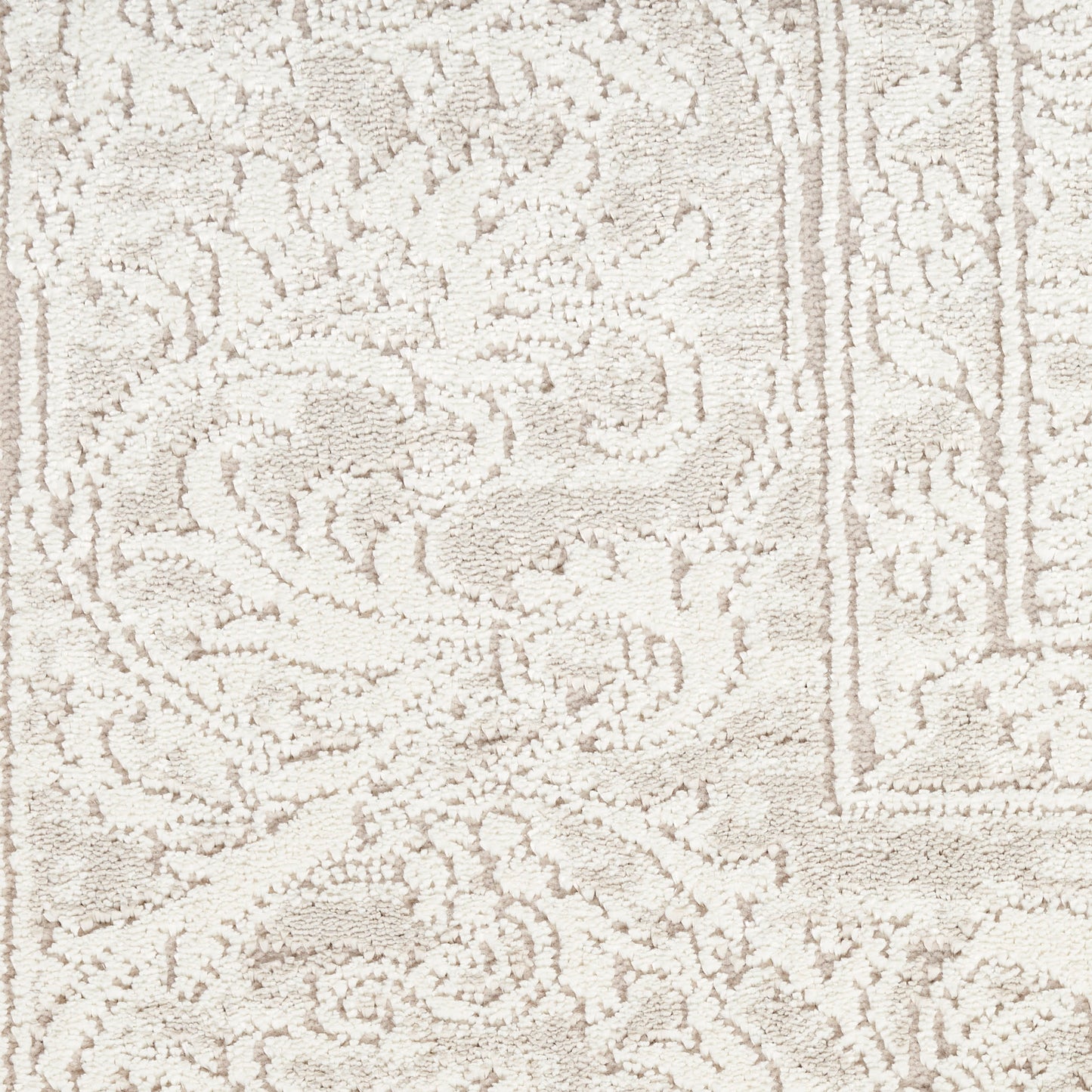 Cream-beige rug with ornate damask floral pattern and border; plush textured pile for neutral living spaces.