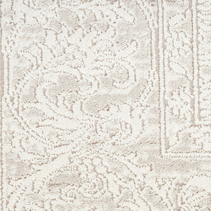 Cream-beige rug with ornate damask floral pattern and border; plush textured pile for neutral living spaces.