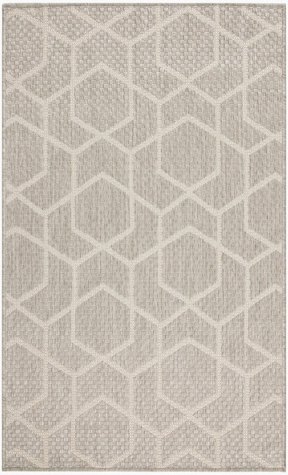 Neutral beige area rug with a raised hexagonal-diamond pattern and textured woven surface.