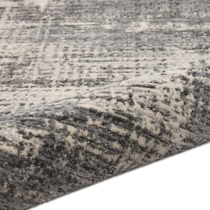 Gray and ivory distressed patterned rug with plush, soft pile.