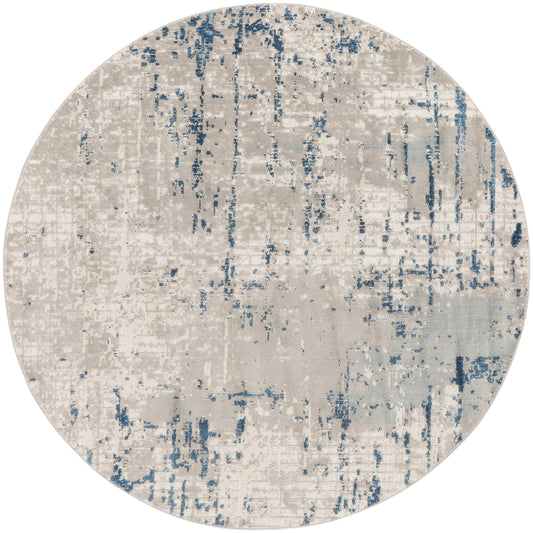Round abstract area rug in beige and ivory with blue distressed accents; modern textured pile.