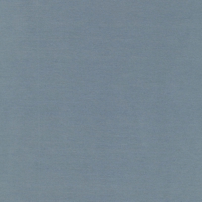 Close-up of solid blue woven fabric texture with visible grain, ideal for upholstery or apparel.