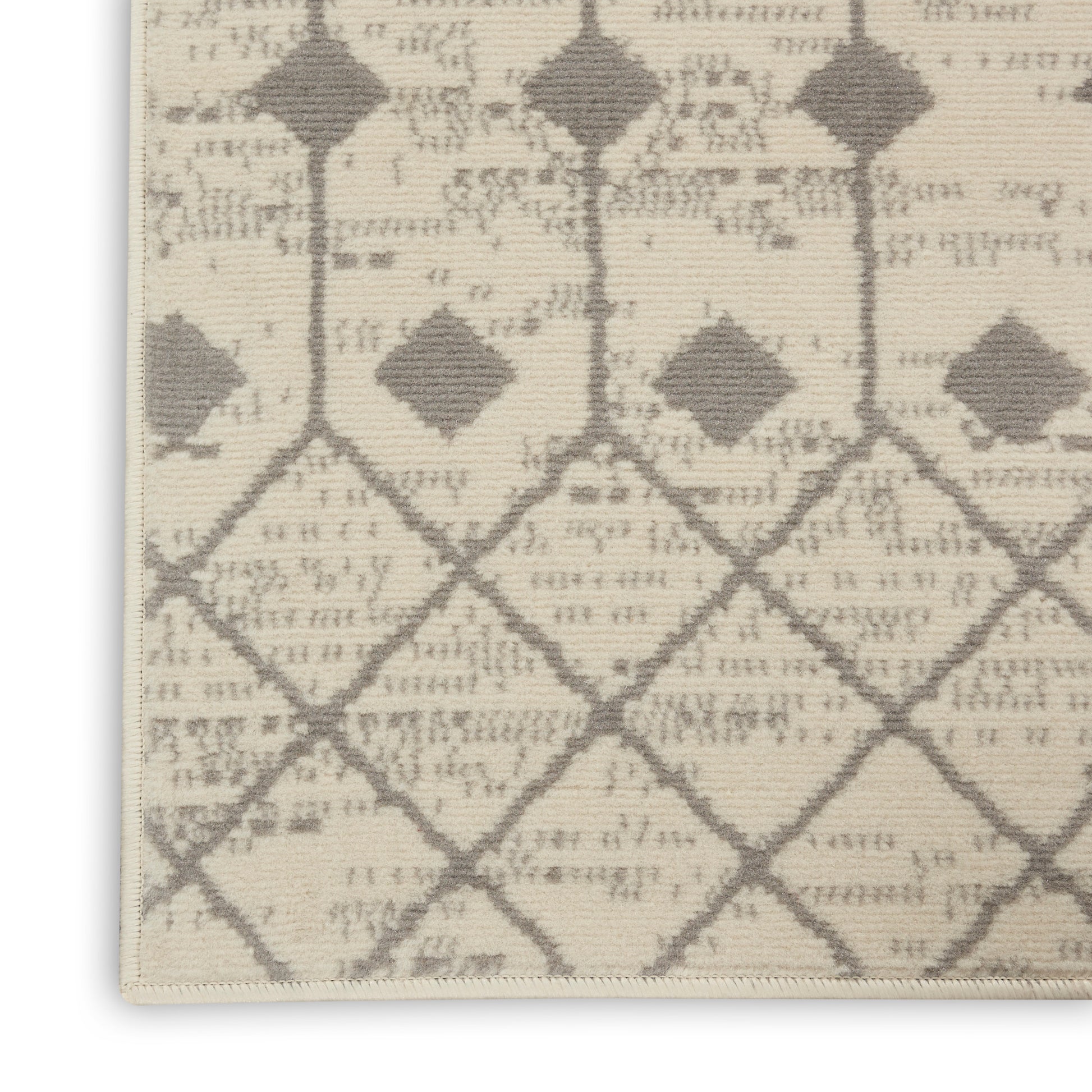 Beige woven runner with taupe diamond lattice trellis pattern; neutral, geometric decor with subtle texture.