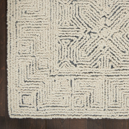 Cream shag rug with navy blue geometric maze pattern, plush high-pile texture, ideal for living spaces