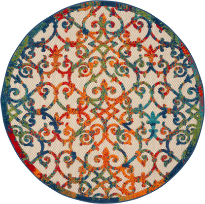 Round decorative rug with multicolor orange, teal, blue and green arabesque lattice pattern on cream, bordered in dark blue.