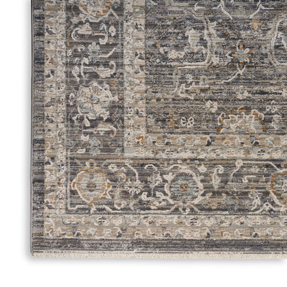 Distressed gray & ivory ornate rug with floral medallions, subtle blue & rust accents, fringe edge.