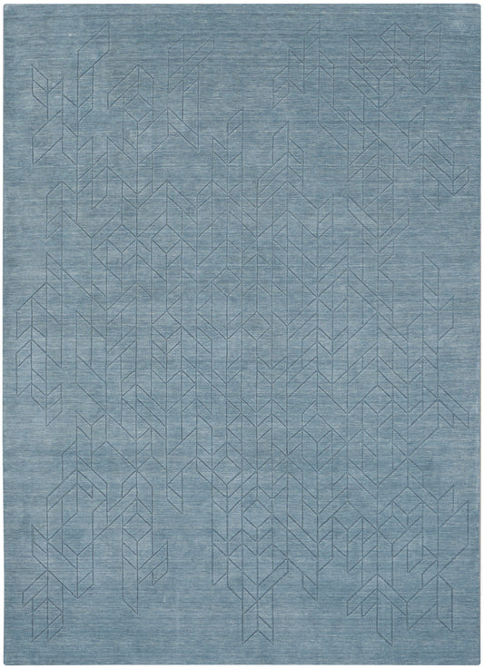 Blue textured rug with a subtle geometric chevron/tree line pattern.