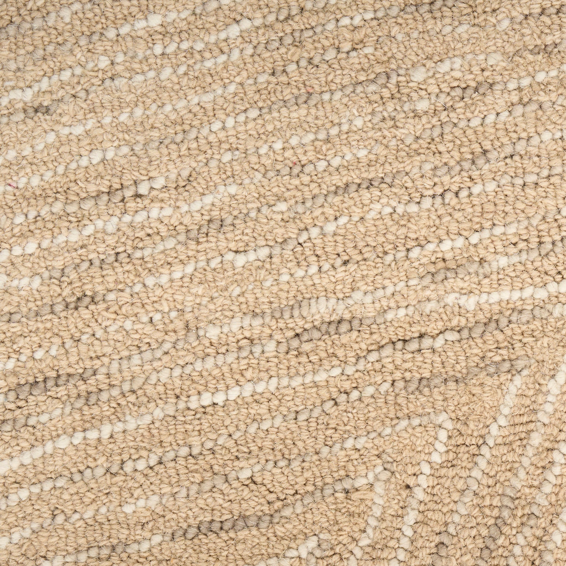 Beige loop-pile carpet close-up with a subtle geometric pattern; soft, durable home flooring.