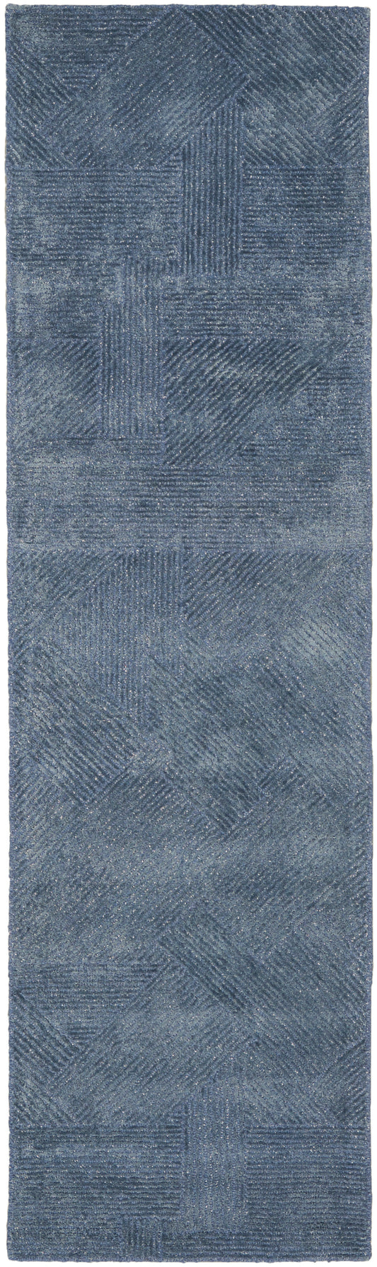 Blue patchwork rug runner with textured squares and diagonal line patterns, soft brushed surface.