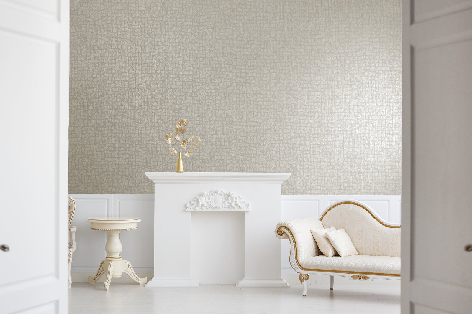 Beige textured wallpaper by Galerie Wallcoverings from the Adonea collection. This plain wallpaper features a soft neutral texture that adds warmth and depth to living rooms, bedrooms, dining rooms, hallways, and feature walls. Washable paste-the-wall paper wallpaper made in the UK.