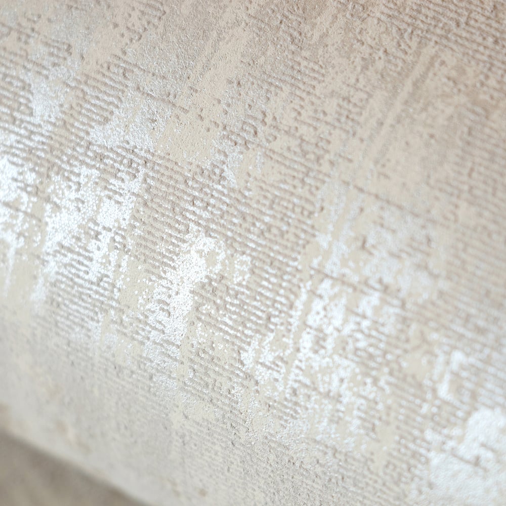 Beige textured wallpaper by Galerie Wallcoverings from the Adonea collection. This plain wallpaper features a soft neutral texture that adds warmth and depth to living rooms, bedrooms, dining rooms, hallways, and feature walls. Washable paste-the-wall paper wallpaper made in the UK.