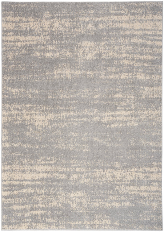 Abstract gray and beige area rug with mottled brushed texture; rectangular, modern neutral style.