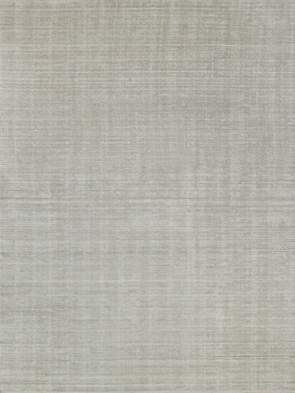Beige-gray textured rug with linen-like weave; indoor hand-loomed rug, 6' x 9'.