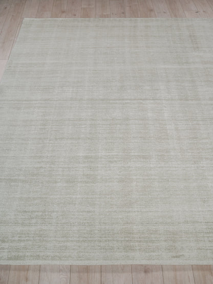 Light beige-gray rug with subtle horizontal texture; rectangular modern flat-weave for living room or bedroom.