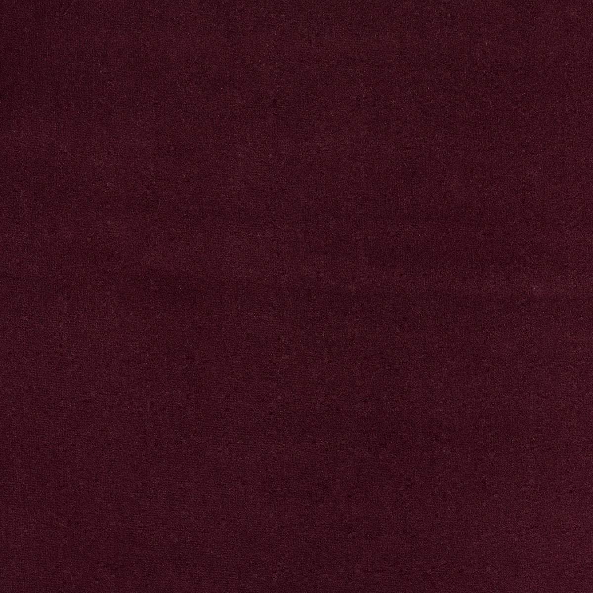 Dark aubergine velvet fabric swatch with plush nap, rich color for upholstery or fashion.
