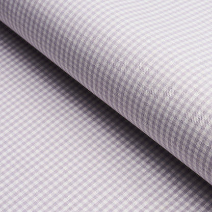 Lilac-and-white gingham cotton fabric, folded roll with tiny checks, ideal for shirts and crafts.