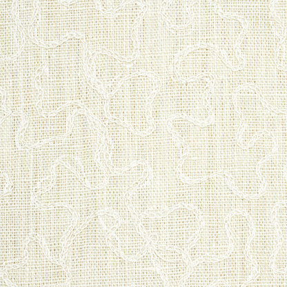 Cream linen fabric with white vermicelli embroidery forming delicate squiggly loop patterns.