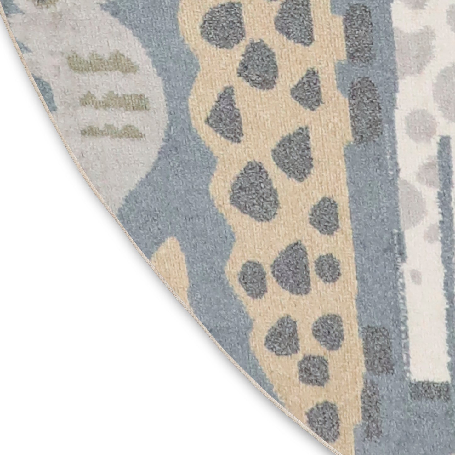 Round abstract rug with blue, beige and gray tones, leopard-spot motif and soft pile.