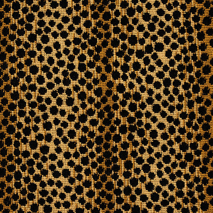 Gold leopard print velvet fabric texture with black spots; luxurious animal-print pattern for dresses or accessories.