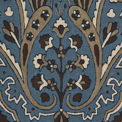 Indigo damask floral pattern on textile with brown, tan and white vines and blossoms.