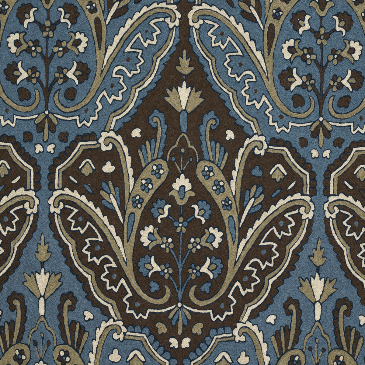 Intricate damask floral pattern in blue, brown and ivory; ornate textile/wallpaper motif with scrolling leaves and blossoms.