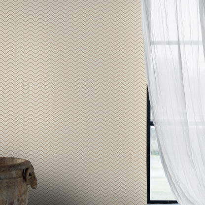 Beige chevron-pattern wallpaper with sheer white curtains beside a black window frame and rustic wooden bowl.