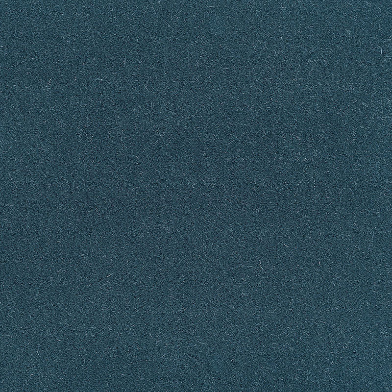 Close-up of dark teal, suede-like fabric texture with fine fibers.