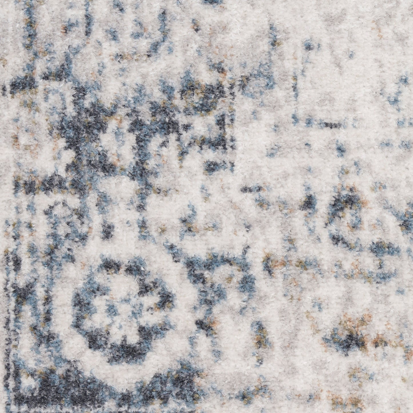 Ivory and blue-gray distressed area rug with faded medallion pattern; plush pile, rectangular living room rug.