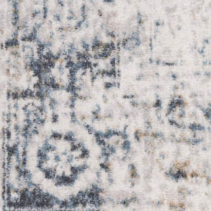 Ivory and blue-gray distressed area rug with faded medallion pattern; plush pile, rectangular living room rug.