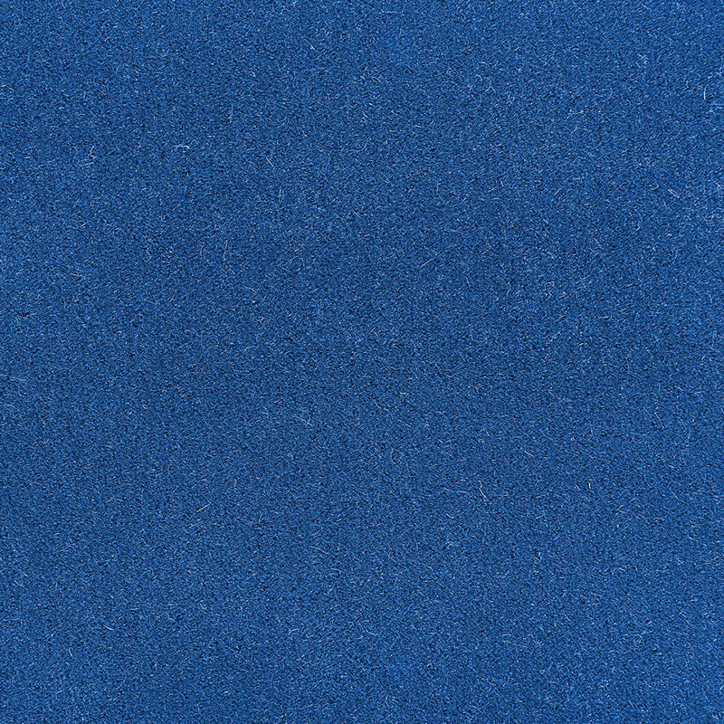 Close-up of cobalt blue felt fabric with soft nap and fine texture, ideal for crafts and padding.