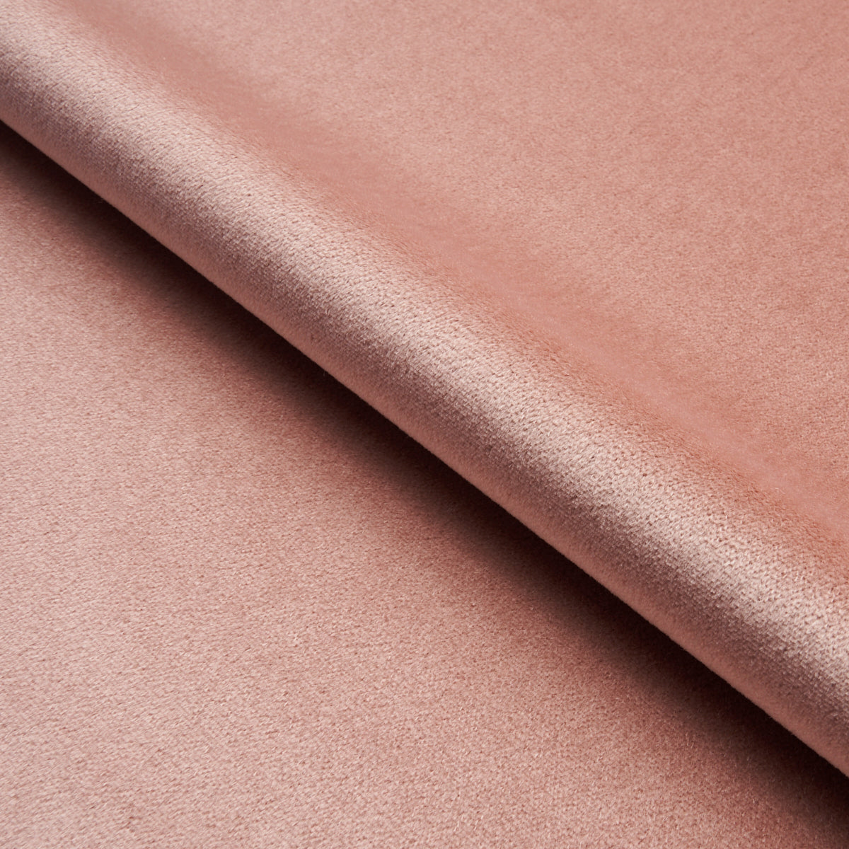 Dusty rose mohair velvet fabric with plush nap texture, suitable for upholstery or apparel.