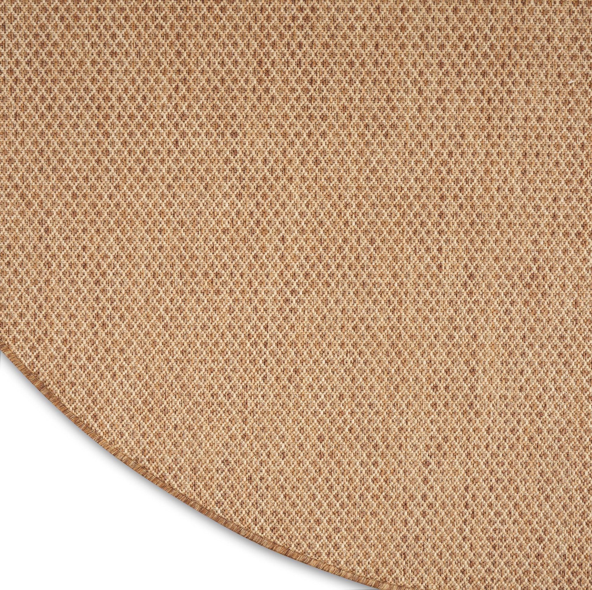 Round beige woven placemat with natural fiber mesh texture.