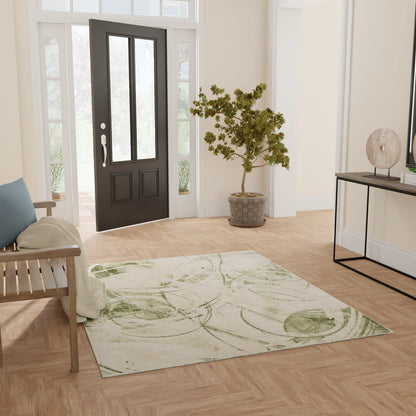 Entryway with black front door, light walls, a pale green leaf-patterned rug, wooden bench, potted tree, and console table.