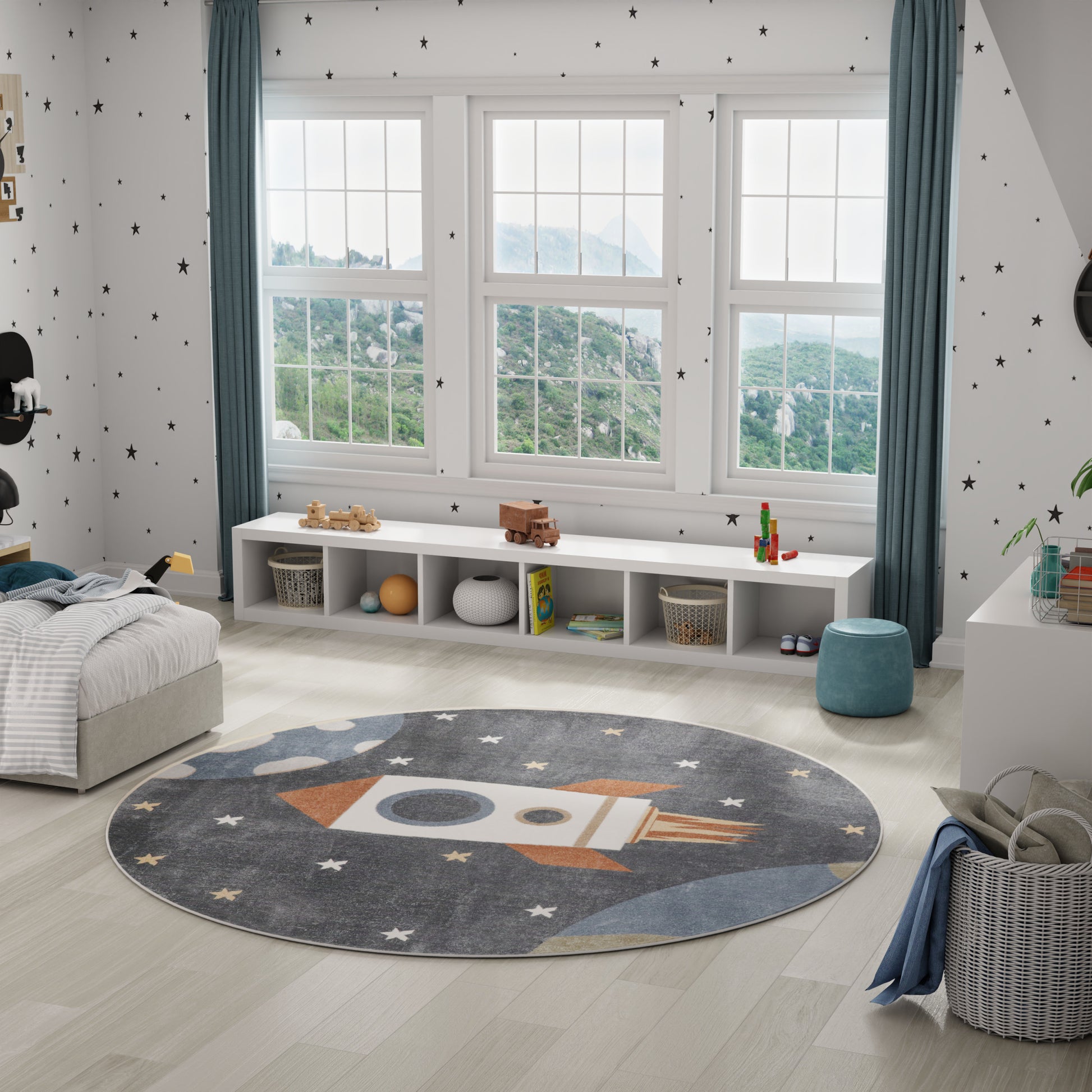 Round gray-blue rocket rug with stars in a bright kids' room; white cubby storage, starry walls, blue curtains.