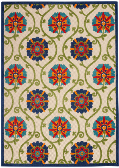 Rectangular area rug with beige background, green vines, turquoise & navy floral medallions with orange accents; blue border.