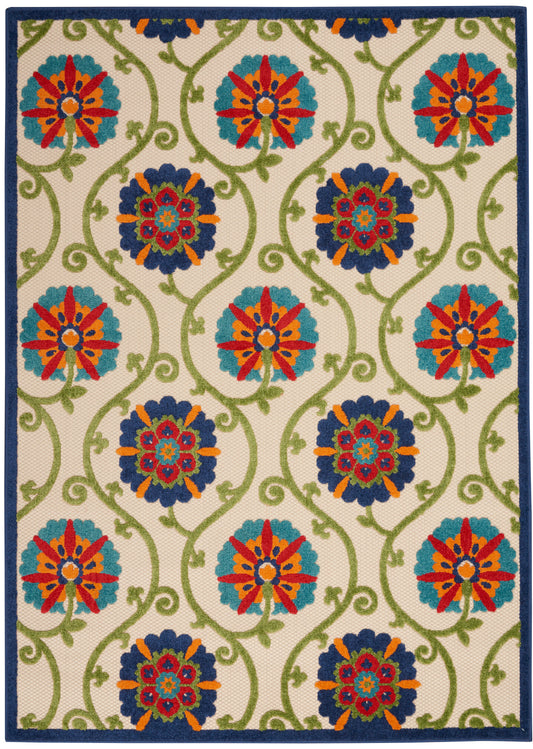 Rectangular area rug with beige background, green vines, turquoise & navy floral medallions with orange accents; blue border.