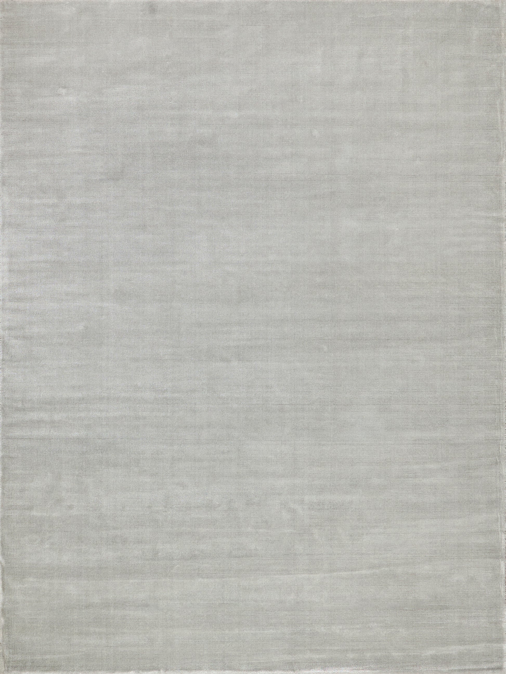 Pale gray rectangular rug with a soft, heathered texture and subtle woven stripes.