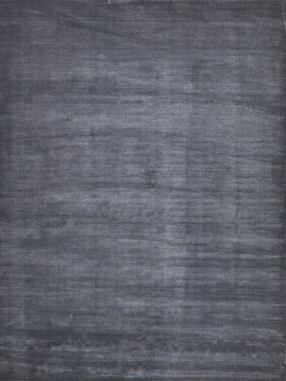 Charcoal gray textured rug with brushed, washed finish for modern & versatile decor.