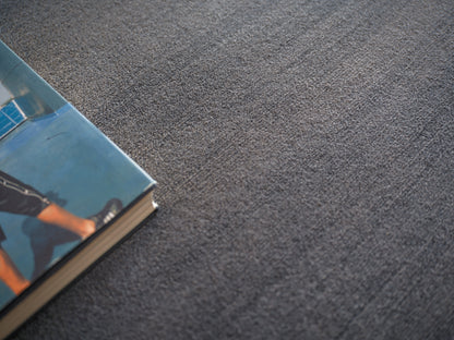 Blue-toned modern indoor hand loomed rug, 4' x 6'.
