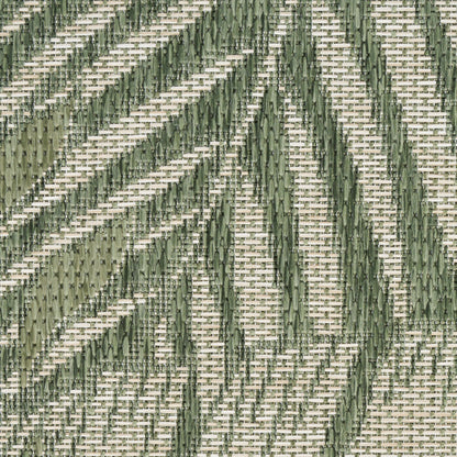 Olive-green geometric chevron pattern on beige outdoor rug; woven textured surface (6' x 9').